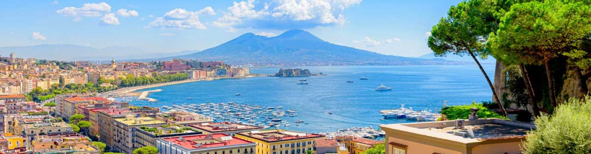 Night tram gliding over cobblestone street in Naples