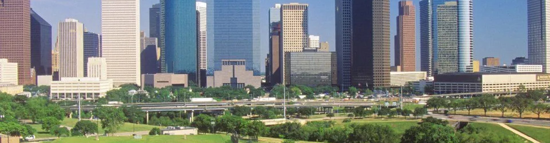 Night tram moving along cobblestones in Houston