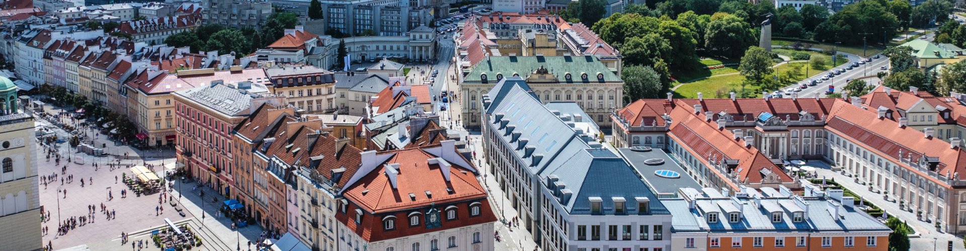 Night tram rolling on Warsaw cobblestone street