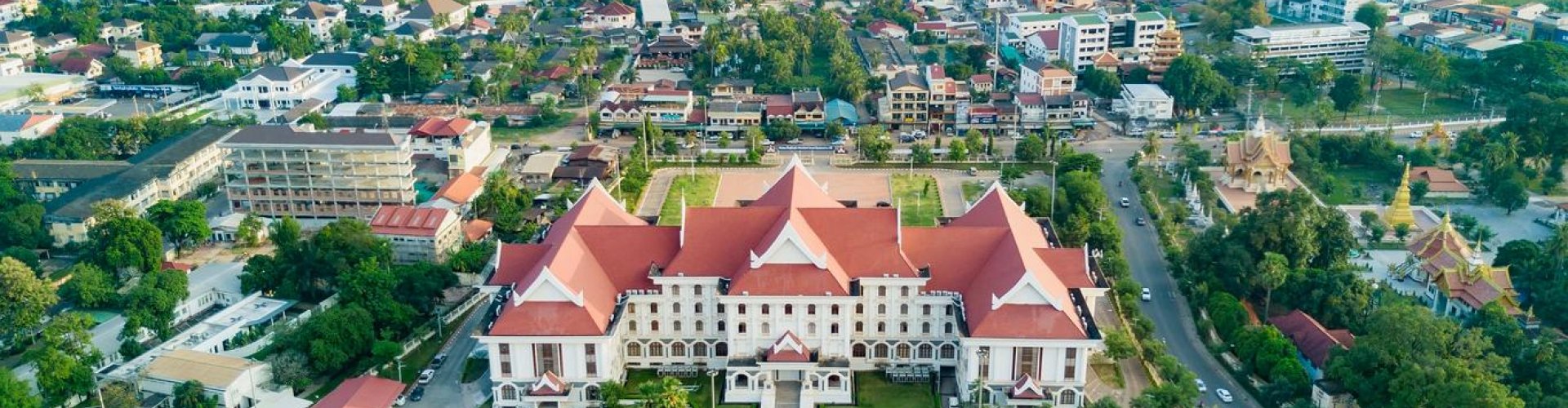 Night tram on cobblestone street in Vientiane