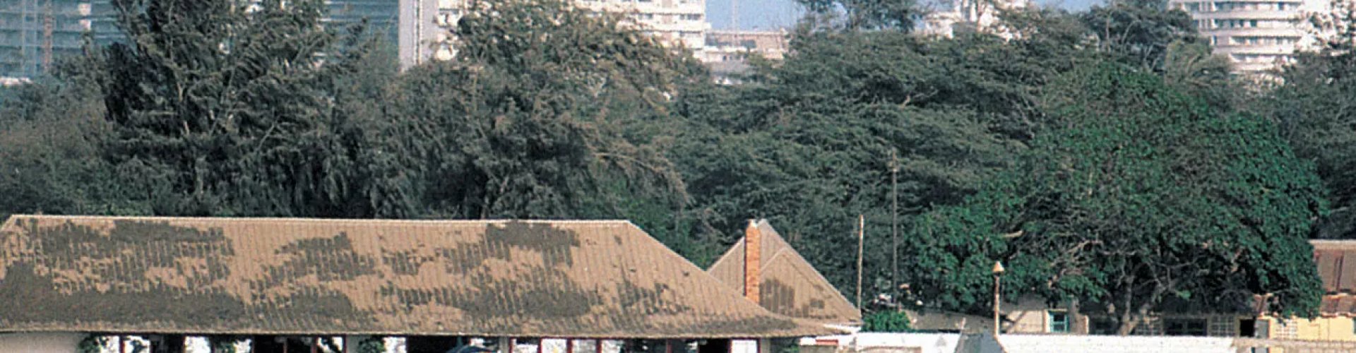 Night tram gliding on cobblestone street in Dakar