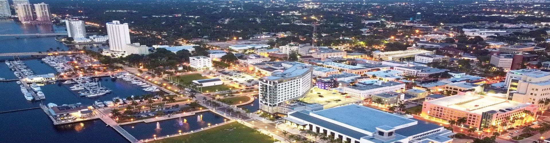 Night tram gliding over cobblestone street in Fort Myers