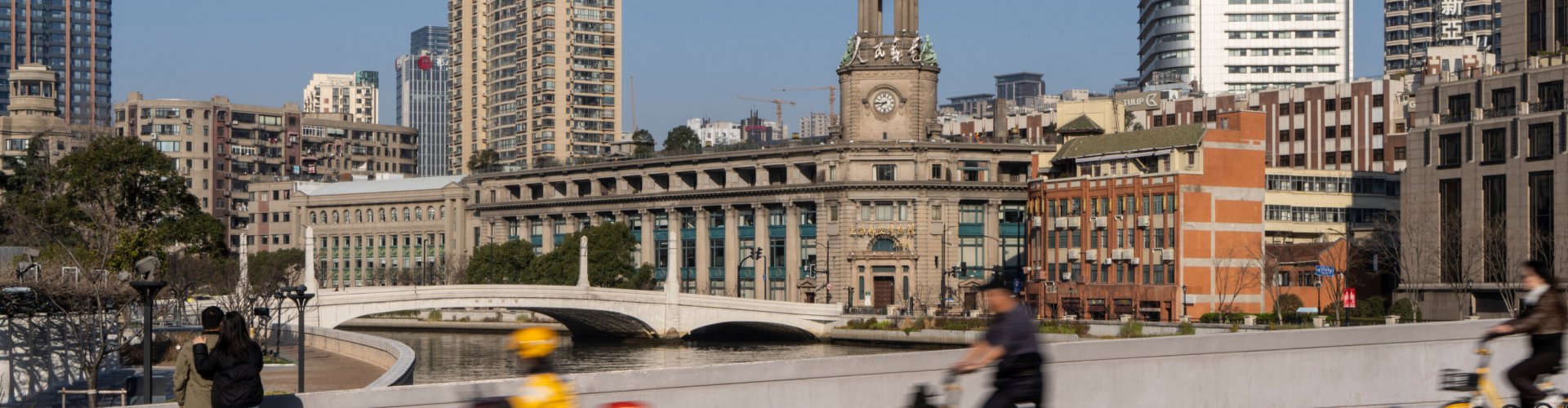 Night tram gliding over cobblestones in Shanghai