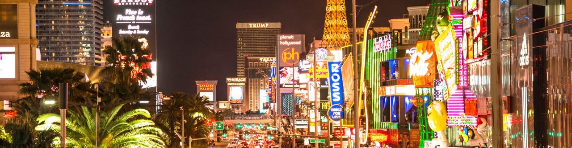 Night tram gleaming on cobblestones in Las Vegas