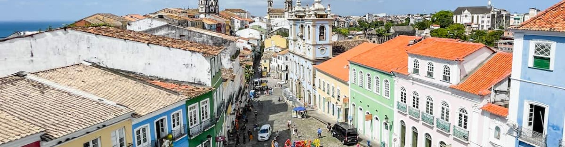 Night tram passing over cobblestones in Salvador