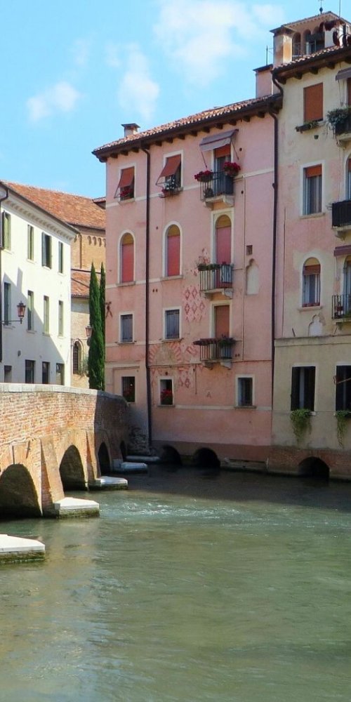 Passenger boarding tram during off-peak in Treviso
