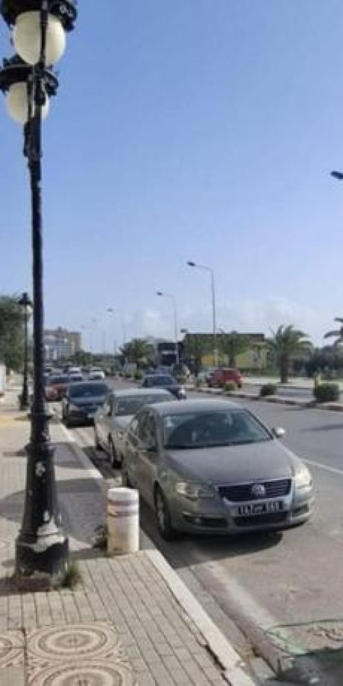 Commuters boarding tram at sunset, Le Bardo, TN