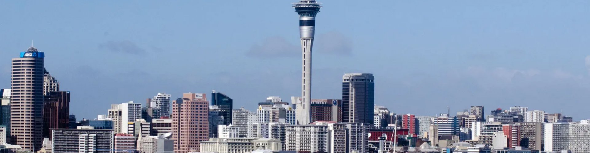 Night tram gliding on cobblestone street in Auckland