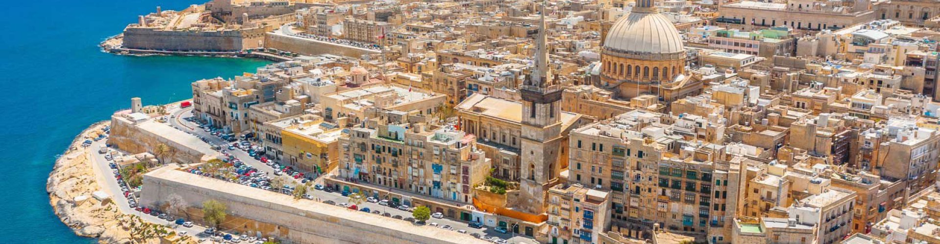 Night tram gliding over cobblestone streets in Malta, MT