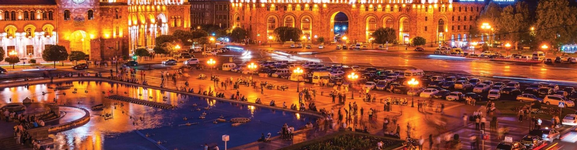 Night tram gliding on Yerevan cobblestones