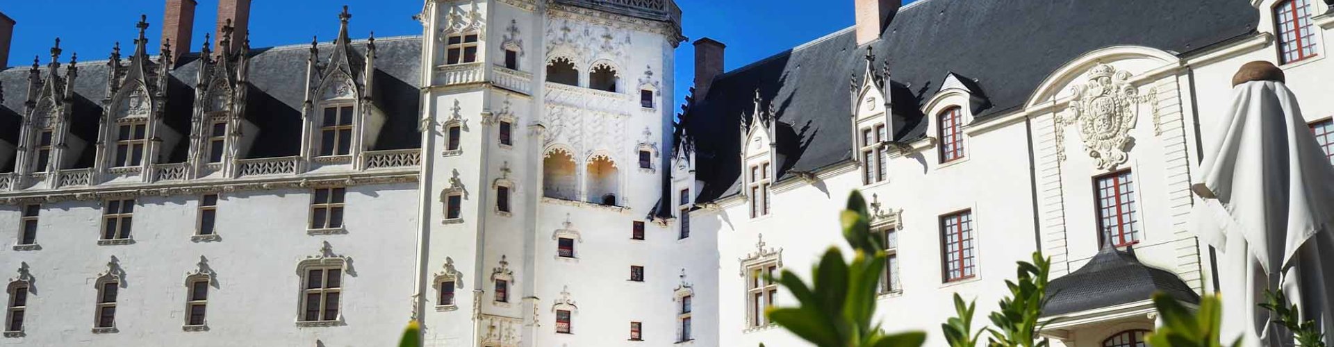 Nantes tram at sunset with passengers boarding