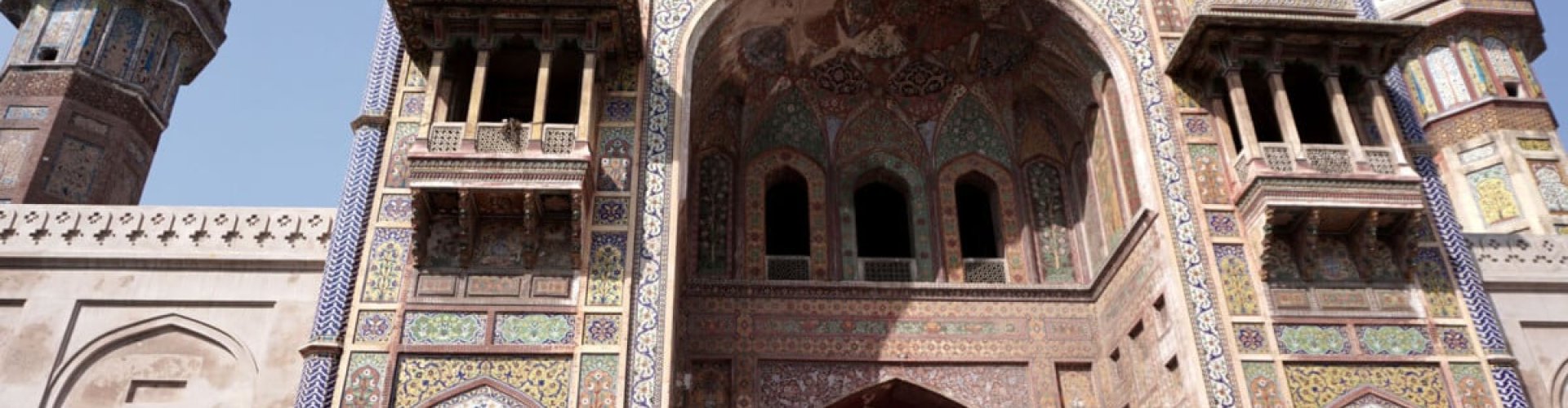 Night tram on cobblestone streets in Lahore