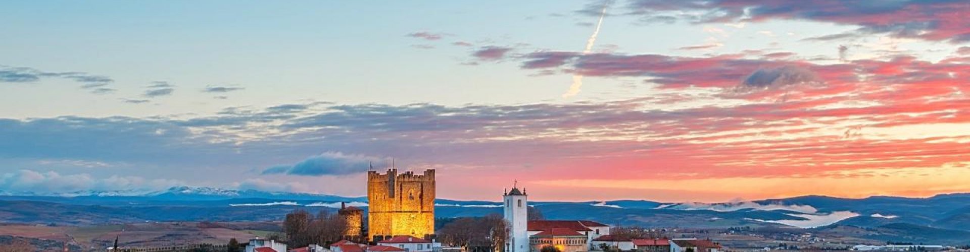 Night tram on cobblestone streets in Bragança