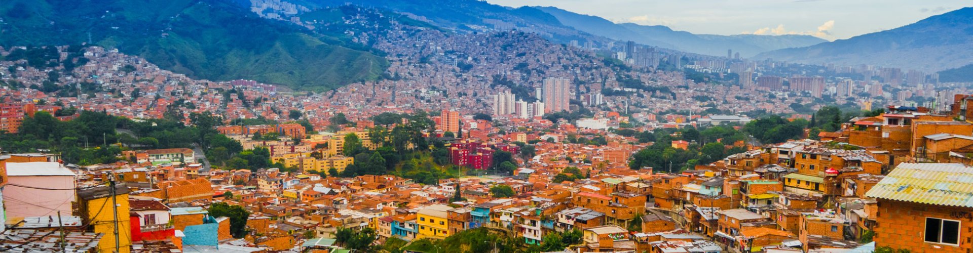 Night tram gliding through Medellin cobblestone streets