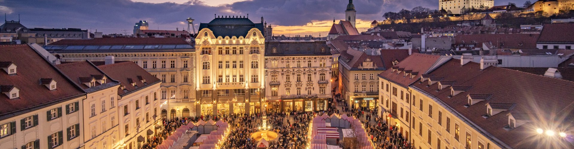 Tram passing historic buildings in Bratislava