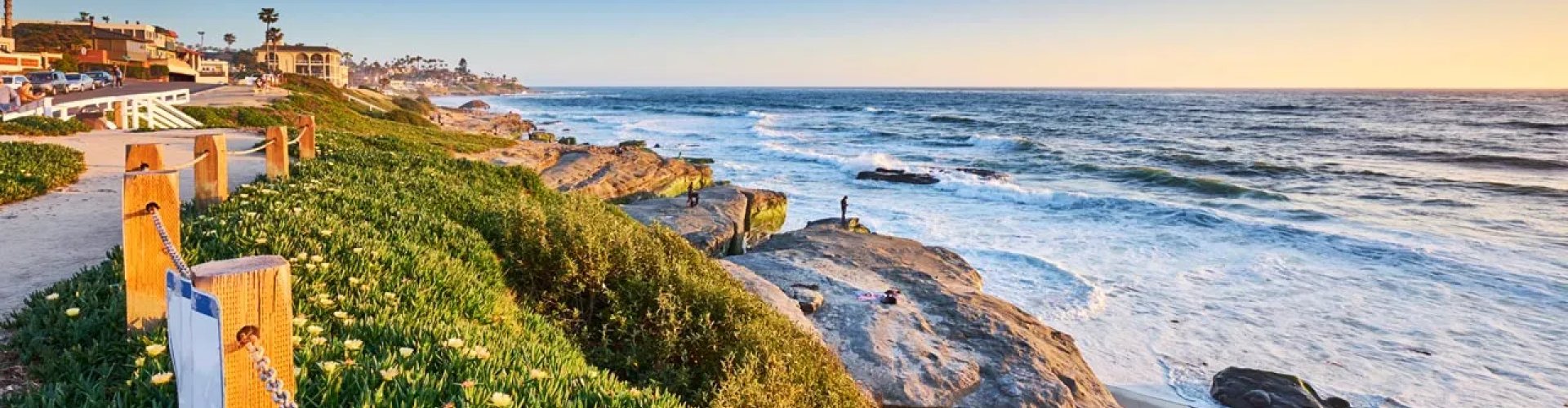 Night tram gliding over cobblestone street in San Diego