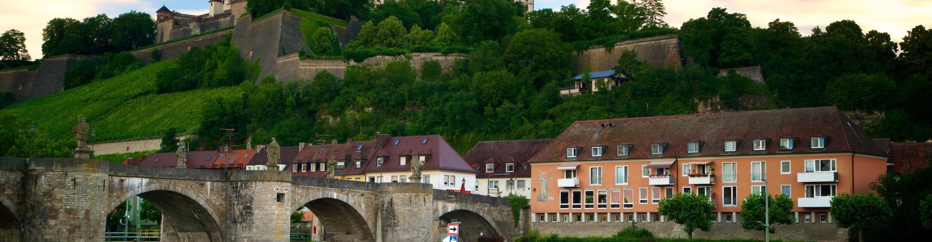 Würzburg night tram gliding over cobblestones