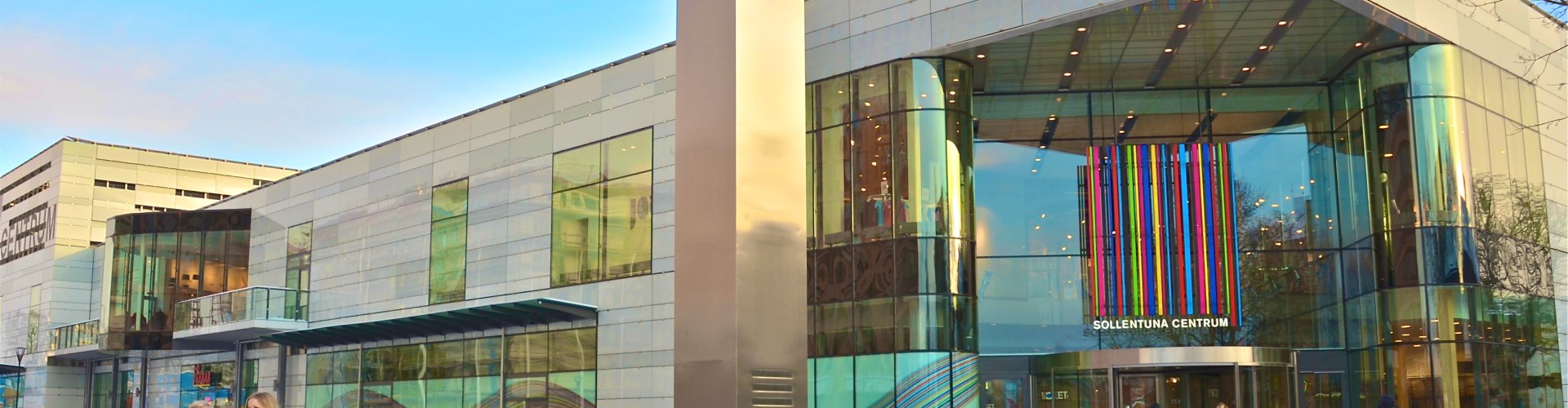 Night tram illuminated on Sollentuna cobblestone street