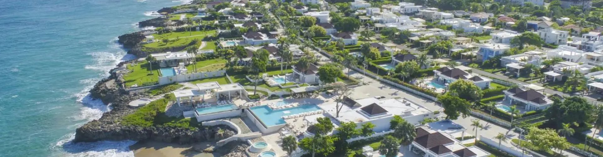 Busy Sosúa street with tram and pedestrians