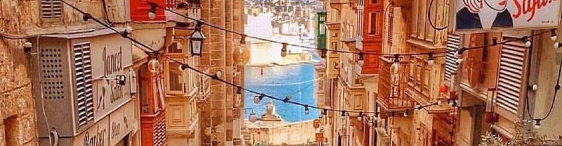 Night tram in Valletta on cobblestone street