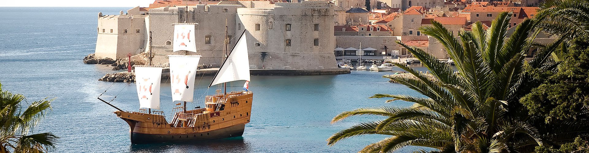 Night tram gliding over cobblestones in Dubrovnik