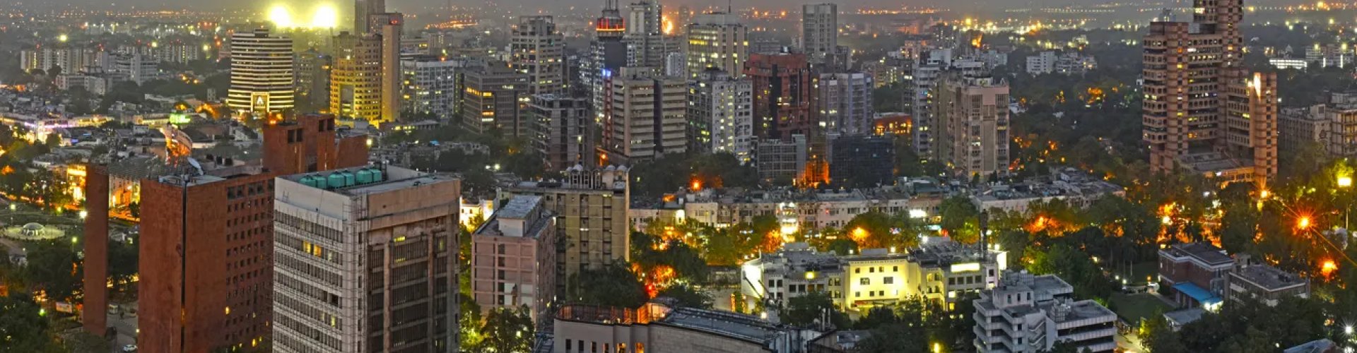 Night tram on cobblestone street in New Delhi