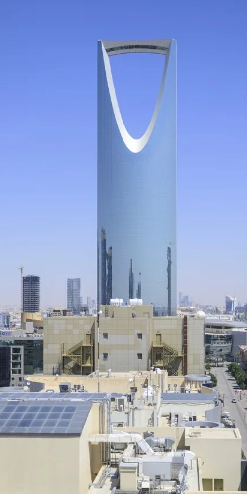 Commuters on Riyadh Metro in evening light