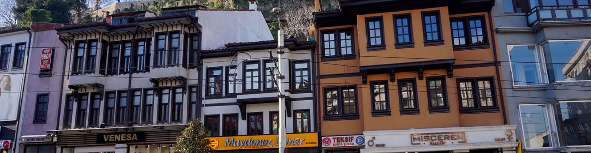 Bursa tram passing historical buildings