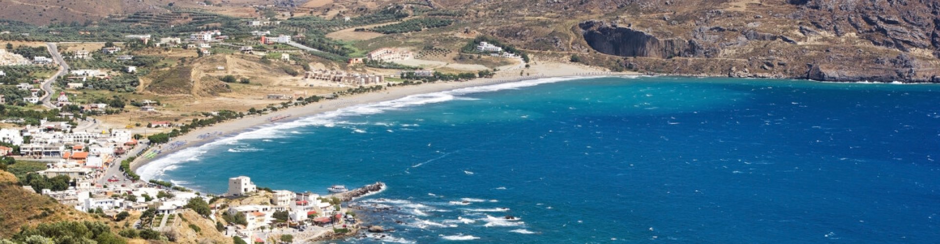Night tram gliding on Plakias' cobblestone street