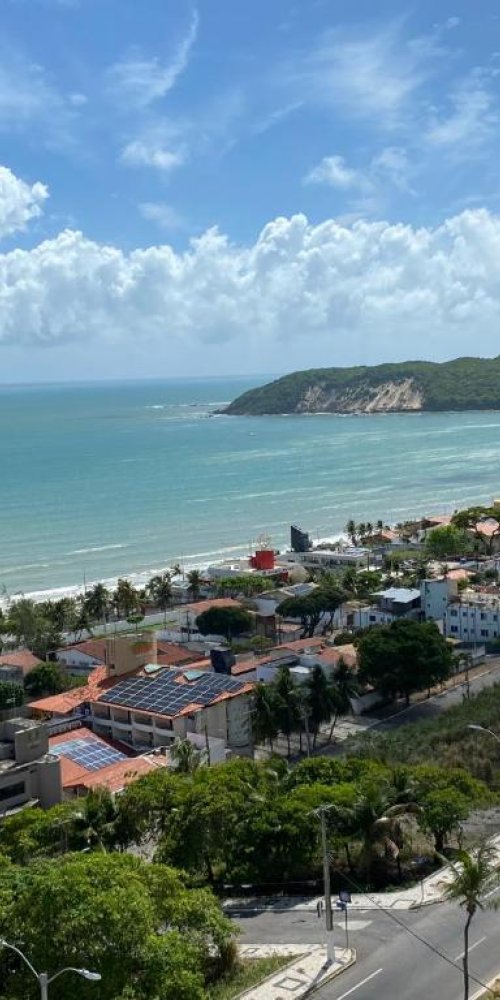 Passenger boarding Ponta Negra tram at sunset