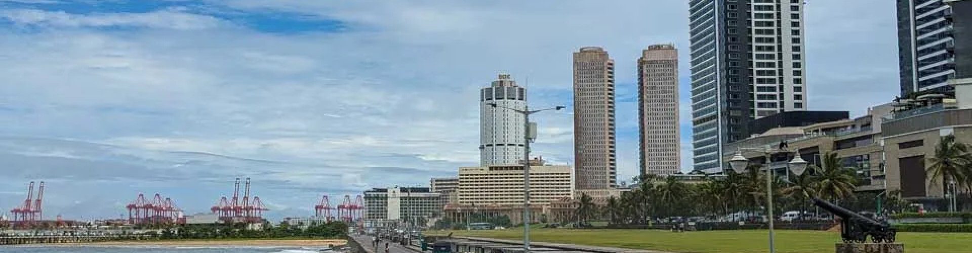 Night tram gliding on cobblestone streets in Colombo under city lights