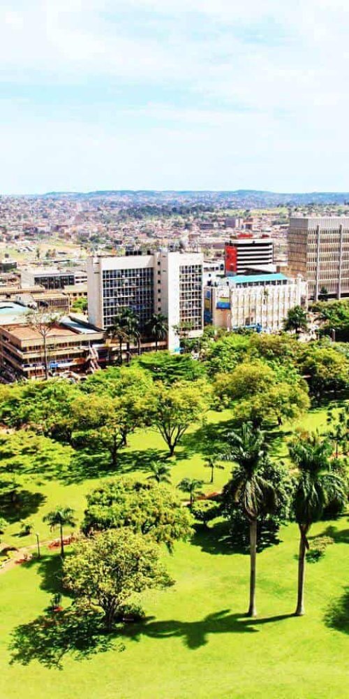Commuters boarding a tram during peak hour in Kampala
