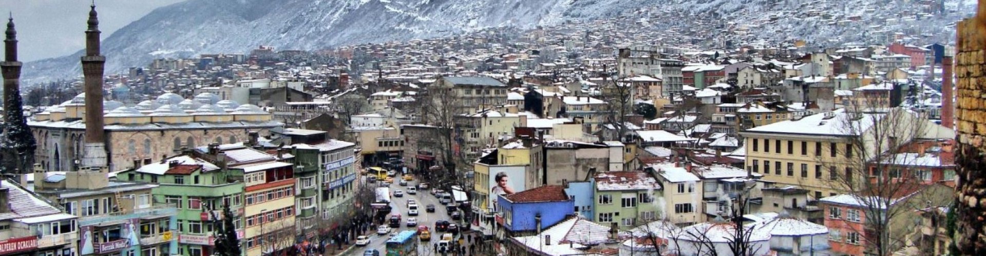 Night tram gliding over cobblestone streets in Bursa