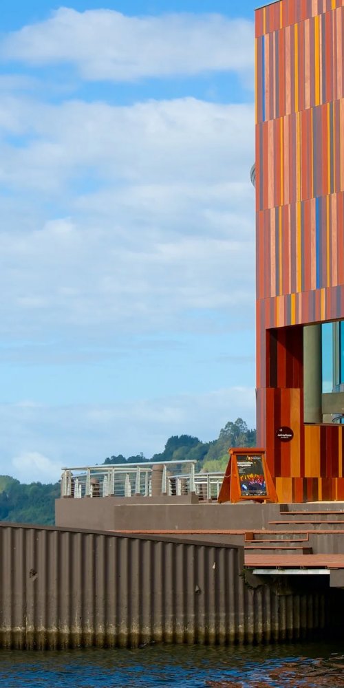 Quiet tram route along Puerto Montt waterfront at dusk