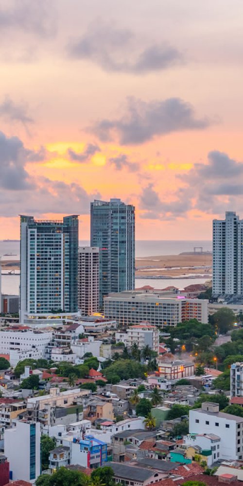 Commuters boarding a metro train during peak hour in Colombo