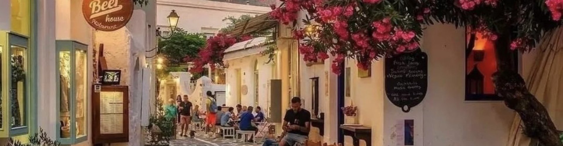 Night tram on cobblestone street in Páros