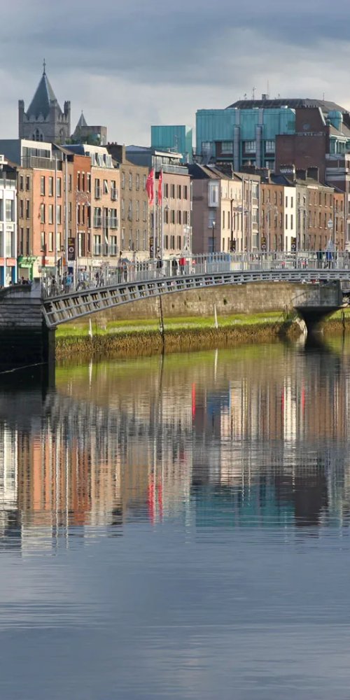 Dublin tram at quiet stop during sunset