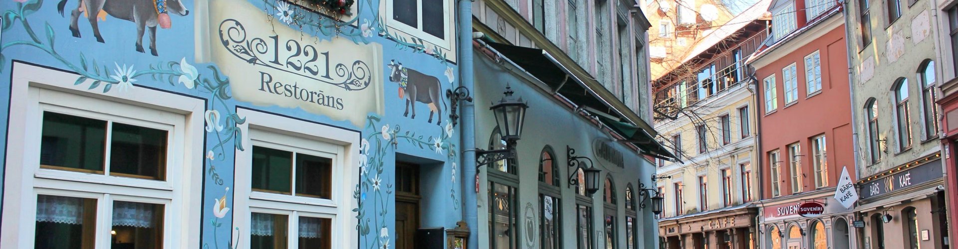 Night tram on cobblestone street in Rīga