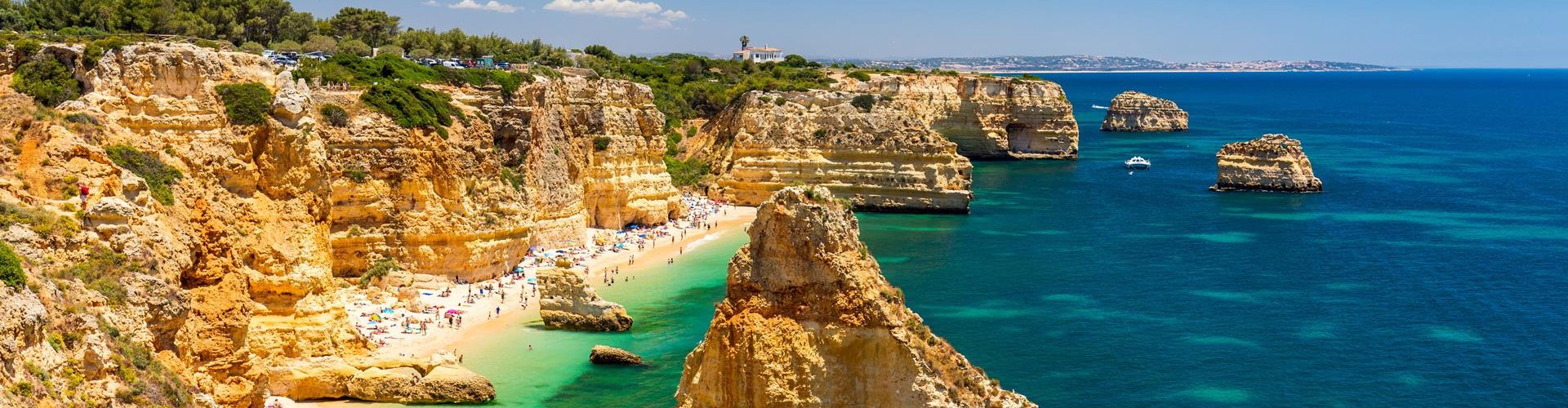 Tram sliding through Armacao De Pera street