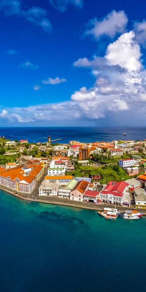 A tram waiting at a quiet station during off-peak hours